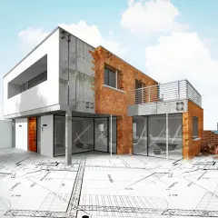 Nowoczesny, niedokończony dom z cegły i betonu, stojący na planach architektonicznych. To wizja wymarzonego domu w budowie.
